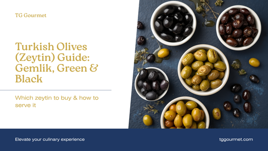 Turkish table olive spread with black Gemlik olives, wrinkled sele olives, and cracked green kırma olives in bowls, dressed with olive oil and dried oregano