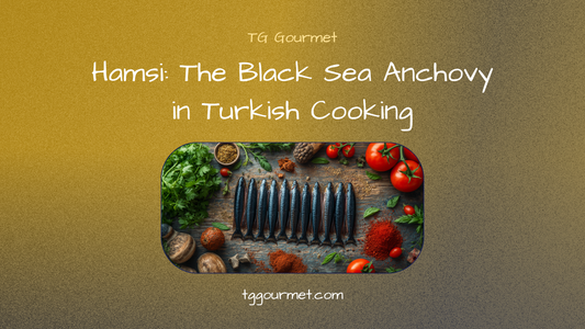 Golden pan-fried hamsi (Black Sea anchovies) dusted in corn flour, fanned in a skillet with lemon and raw onion
