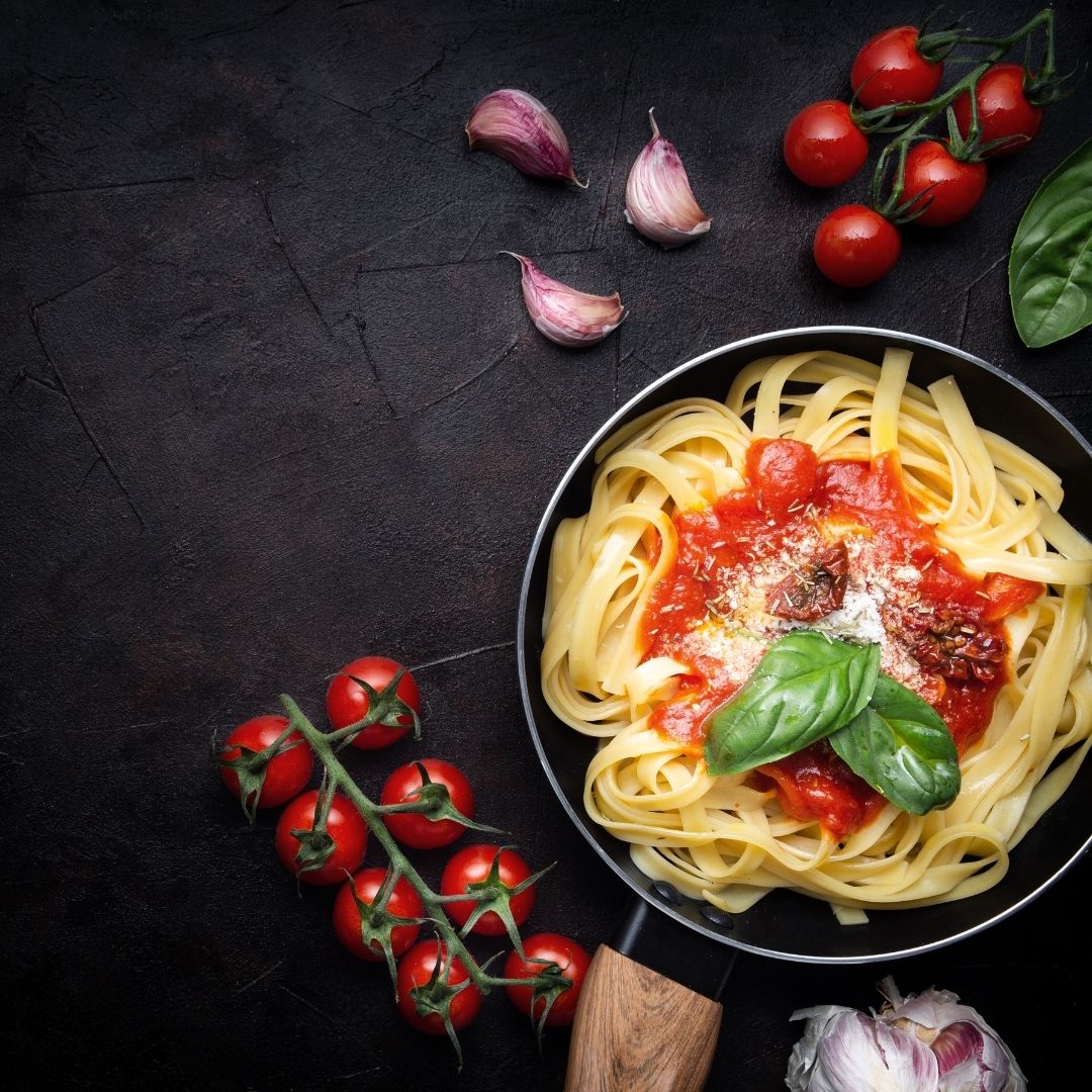 Fresh pasta served with different homemade sauces on a table