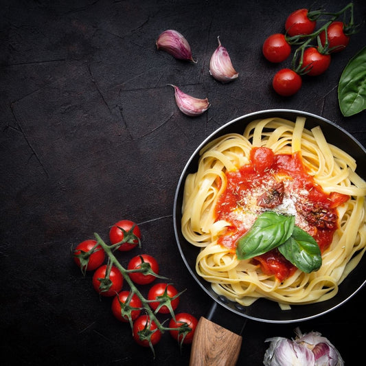 Fresh pasta served with different homemade sauces on a table