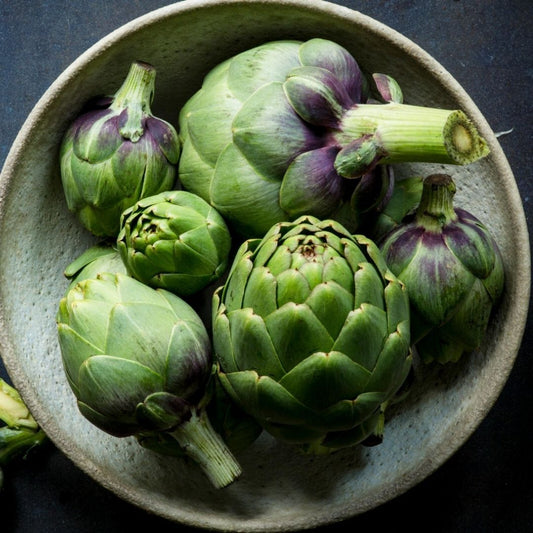 Prepared artichoke bottoms and hearts on a cutting board